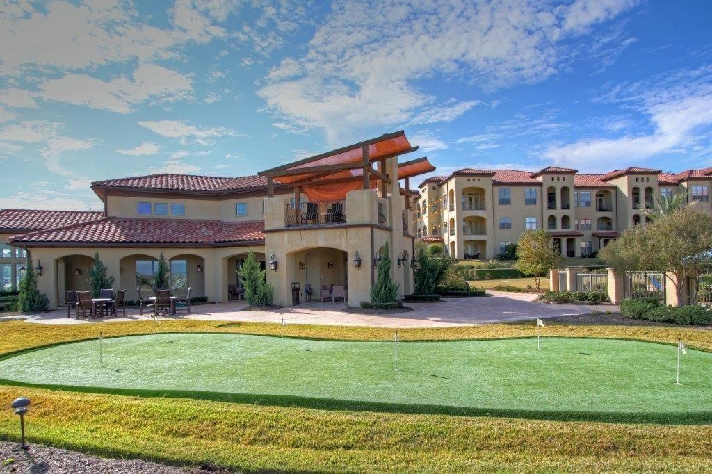 17040 West Fm 1097 Road, Unit 5103 Montgomery, TX 77356 - Photo 24 of 25 a view of building with swimming pool and outdoor seating