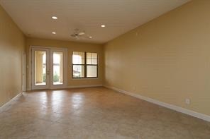 17040 West Fm 1097 Road, Unit 5103 Montgomery, TX 77356 - Photo 5 of 25 a view of an empty room with a window and wooden floor