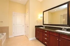 a bathroom with a bathtub and a shower