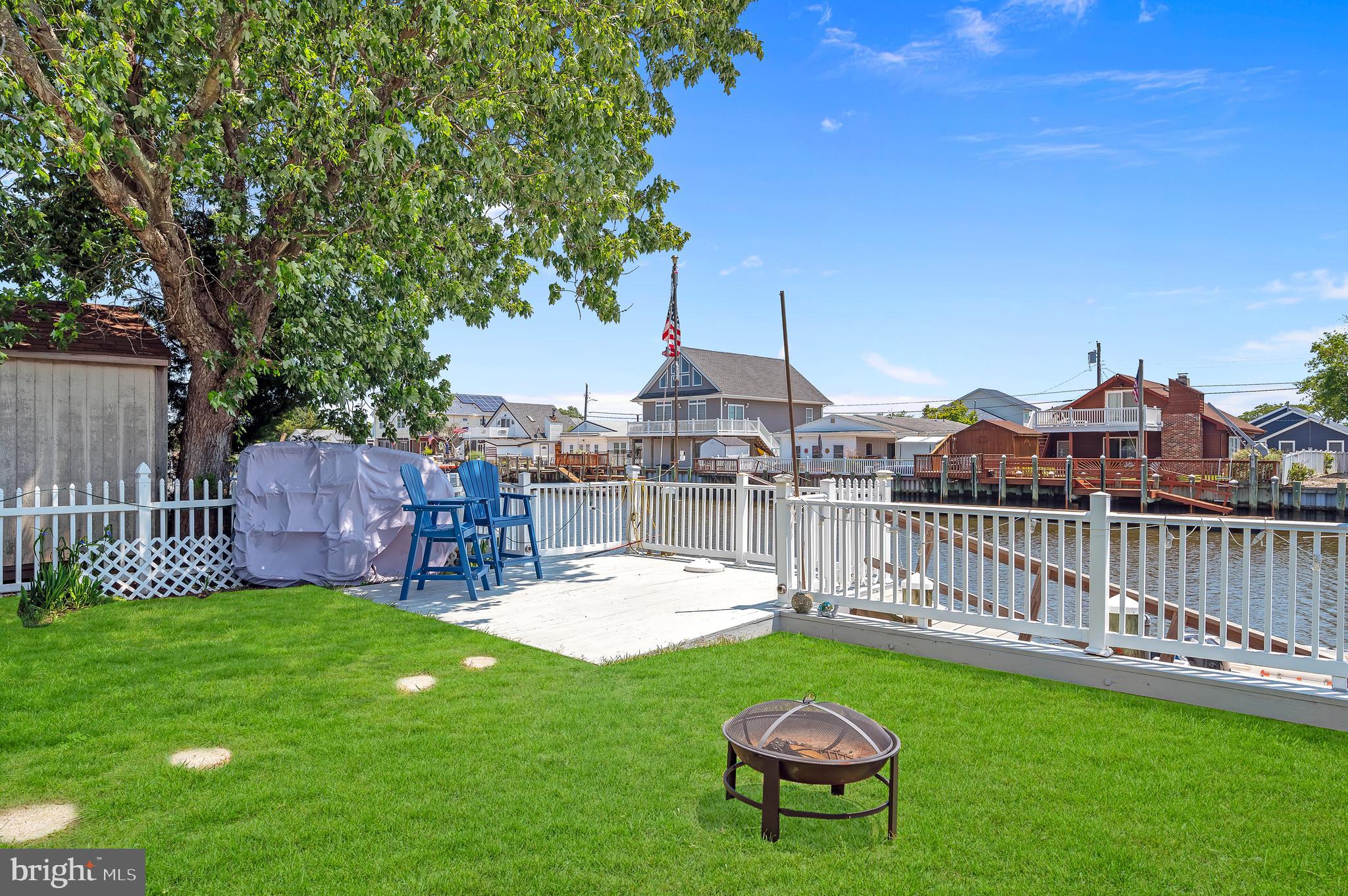 25 West Dory Drive Little Egg Harbor, NJ 08087 - Photo 21 of 56 a view of a chairs and table in backyard