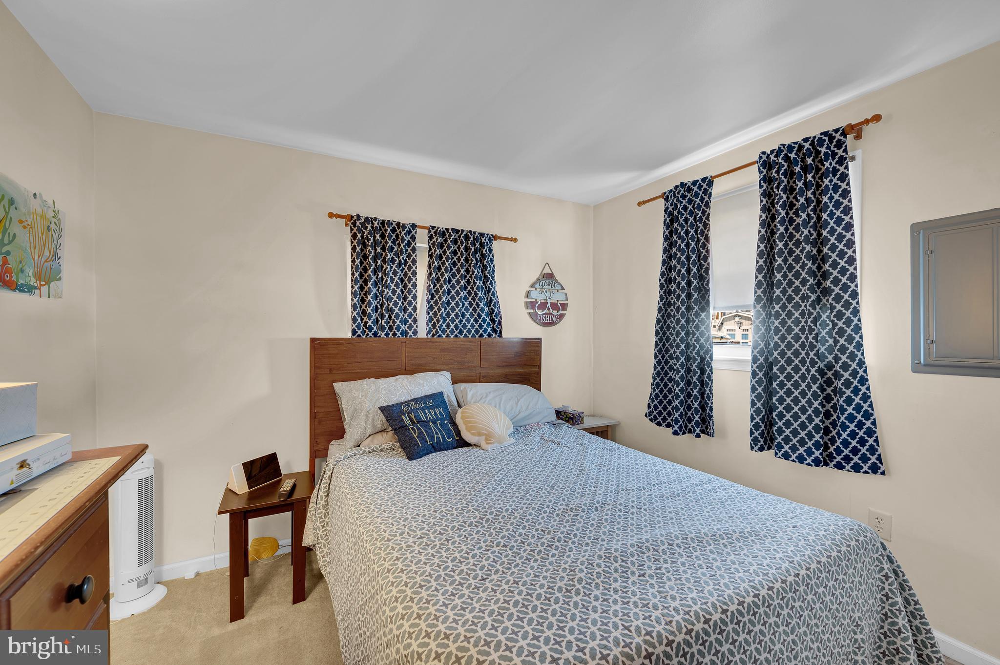 25 West Dory Drive Little Egg Harbor, NJ 08087 - Photo 29 of 56 a bedroom with a bed and wooden floor