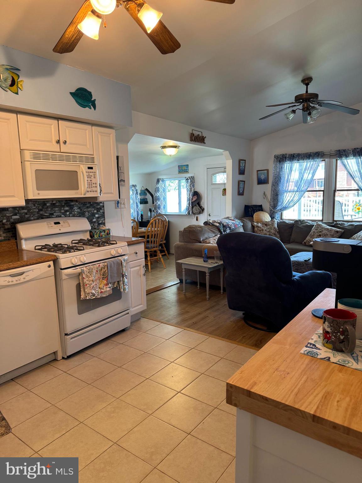25 West Dory Drive Little Egg Harbor, NJ 08087 - Photo 56 of 56 a kitchen with stainless steel appliances granite countertop a stove a sink dishwasher and a microwave oven with cabinets