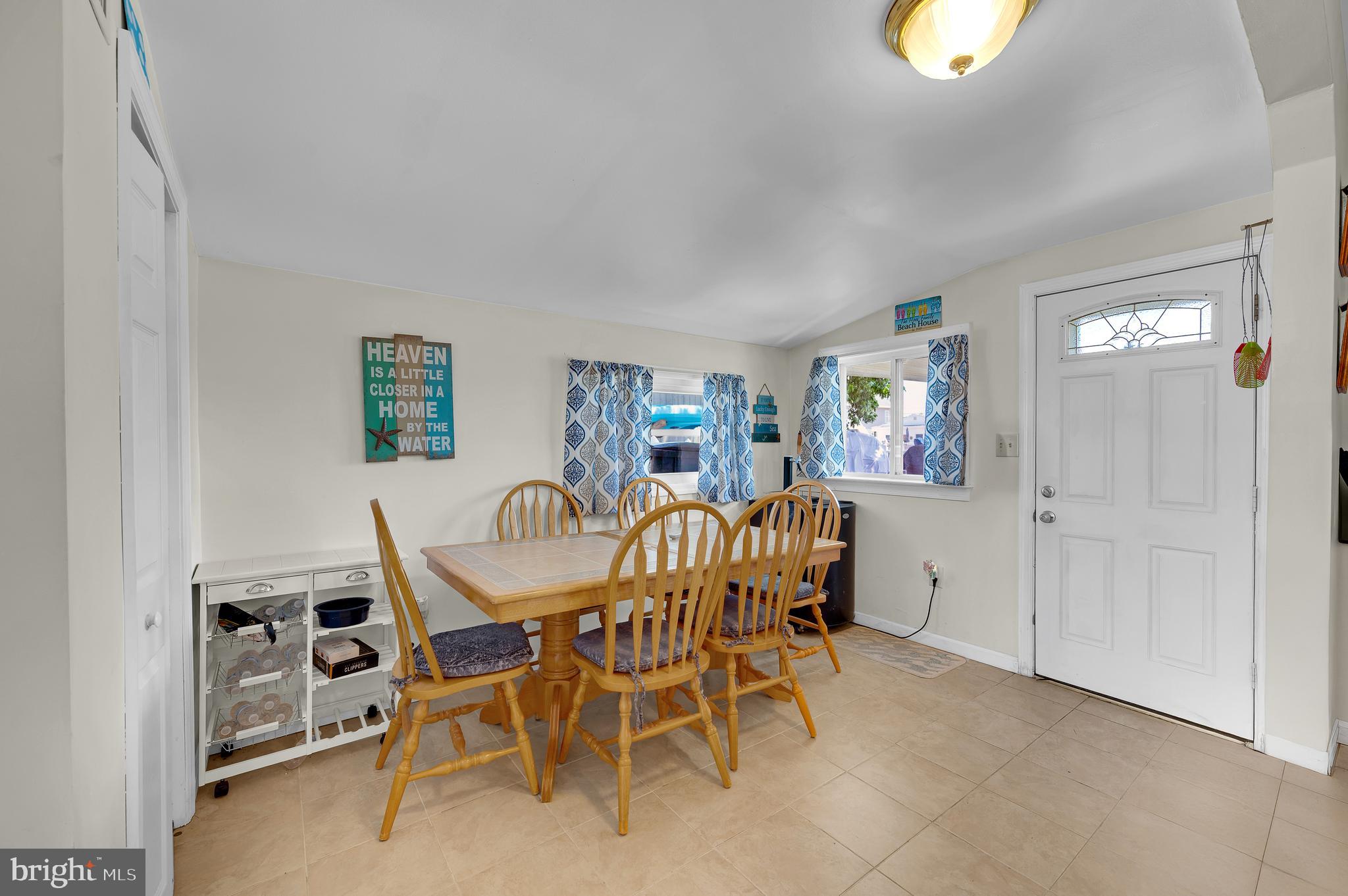 25 West Dory Drive Little Egg Harbor, NJ 08087 - Photo 31 of 56 a view of a dining room with furniture and a chandelier