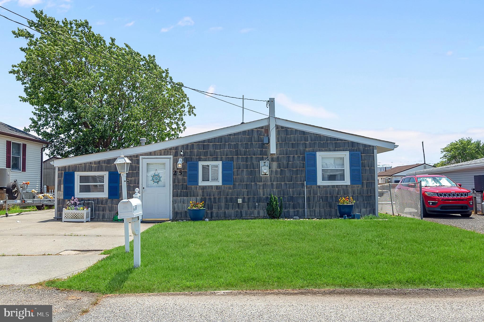 25 West Dory Drive Little Egg Harbor, NJ 08087 - Photo 44 of 56 a front view of house with yard and green space