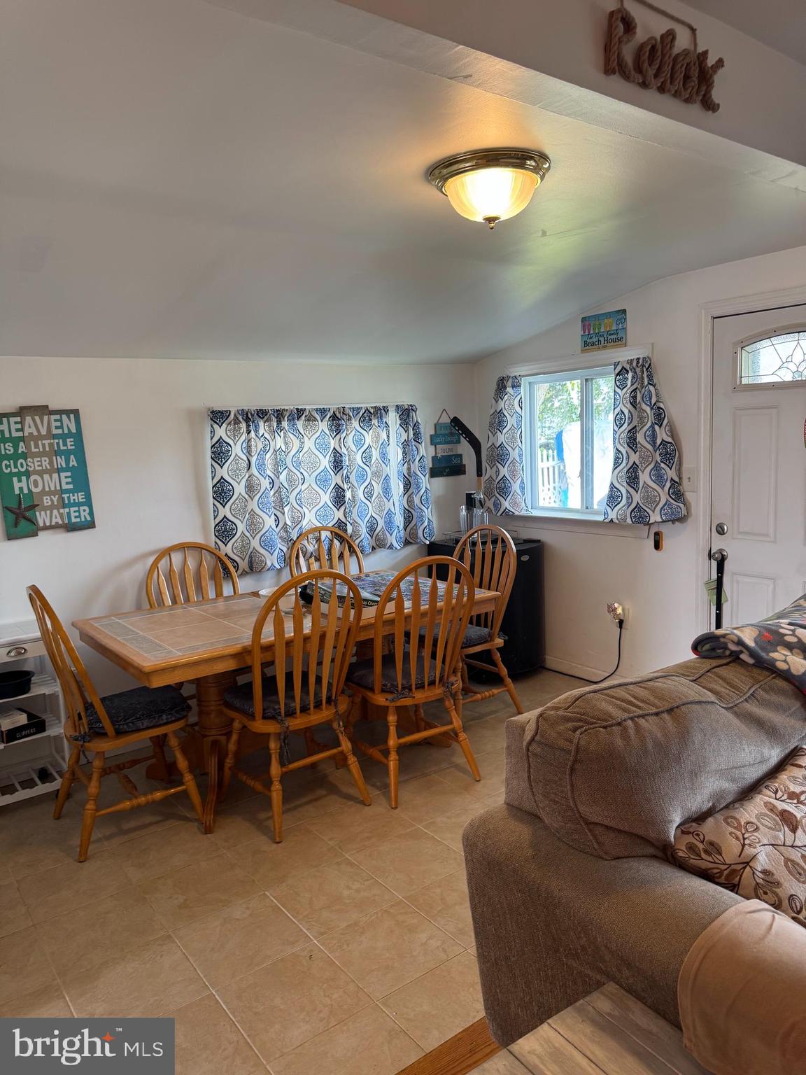 25 West Dory Drive Little Egg Harbor, NJ 08087 - Photo 5 of 56 a living room with furniture a dining table and a chandelier