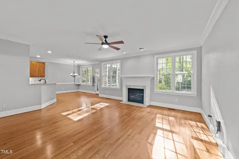 a view of livingroom with fireplace window and outdoor space