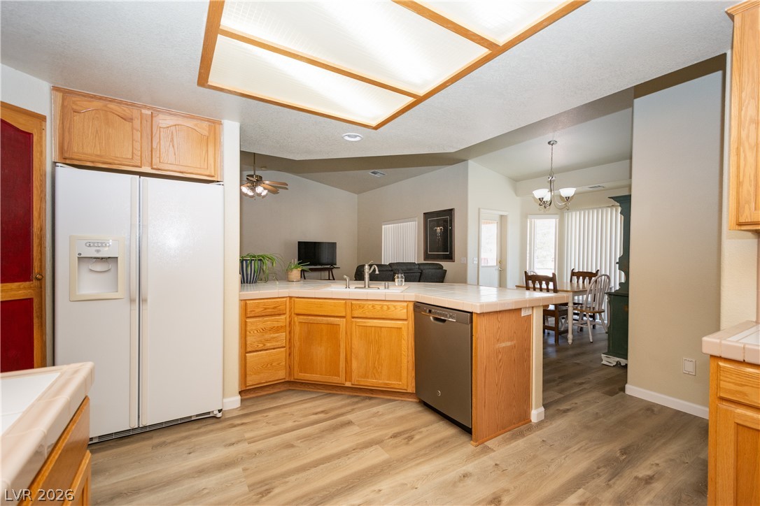 2381 Tough Boy Road Pahrump, NV 89060 - Photo 11 of 44 This open concept kitchen flows seamlessly into dining and living spaces, perfect for gatherings.