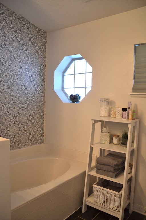 76564 Longleaf Loop Yulee, FL 32097 - Photo 15 of 27 a bathroom with a bathtub and a window