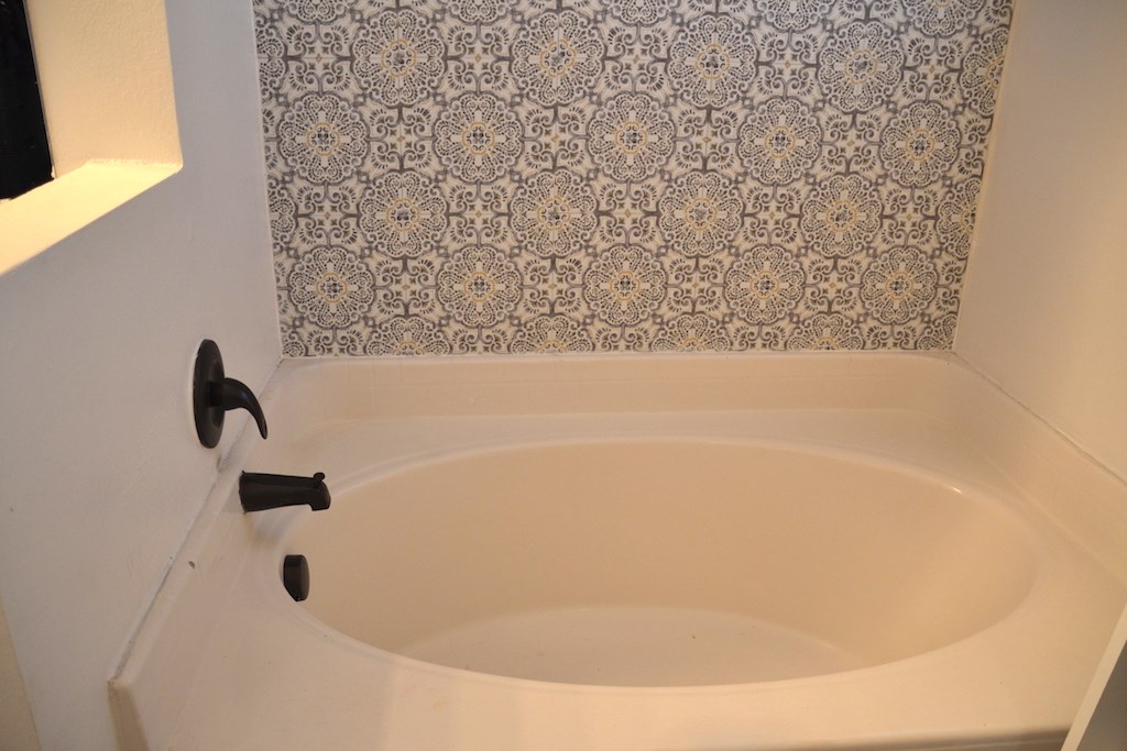 76564 Longleaf Loop Yulee, FL 32097 - Photo 17 of 27 a bathroom with a bathtub