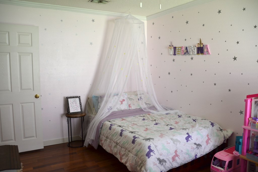 76564 Longleaf Loop Yulee, FL 32097 - Photo 18 of 27 a bedroom with a bed and a closet