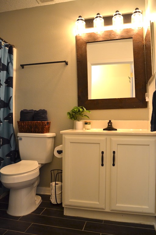 76564 Longleaf Loop Yulee, FL 32097 - Photo 19 of 27 a bathroom with a sink toilet and mirror