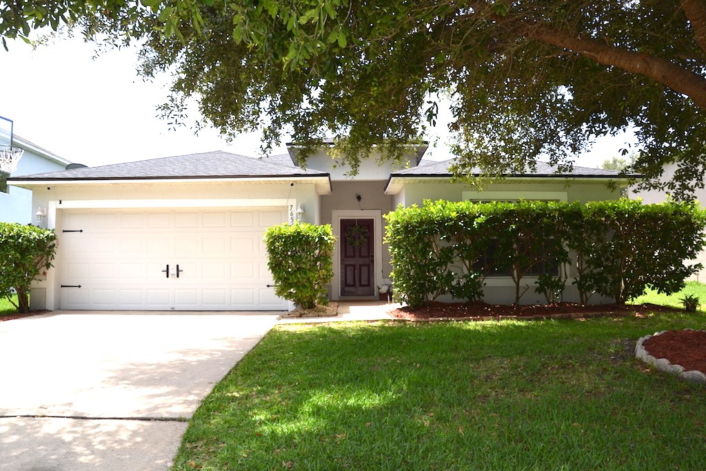 76564 Longleaf Loop Yulee, FL 32097 - Photo 21 of 27 a front view of a house with a yard