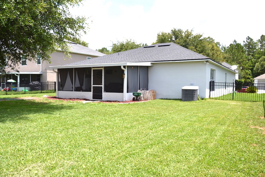 76564 Longleaf Loop Yulee, FL 32097 - Photo 22 of 27 a view of a house with a yard and front view