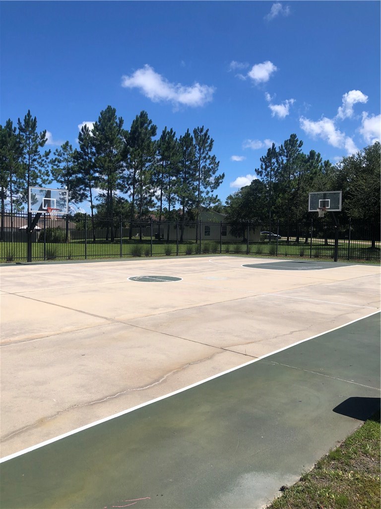 76564 Longleaf Loop Yulee, FL 32097 - Photo 26 of 27 a view of a swimming pool with an outdoor space and seating area
