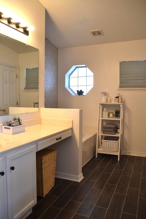 76564 Longleaf Loop Yulee, FL 32097 - Photo 3 of 27 a bathroom with a sink a vanity and a mirror