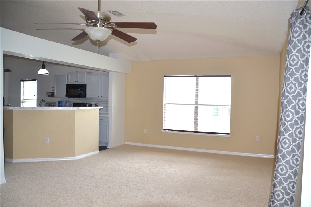 76564 Longleaf Loop Yulee, FL 32097 - Photo 9 of 27 a view of a livingroom with a ceiling fan and a window