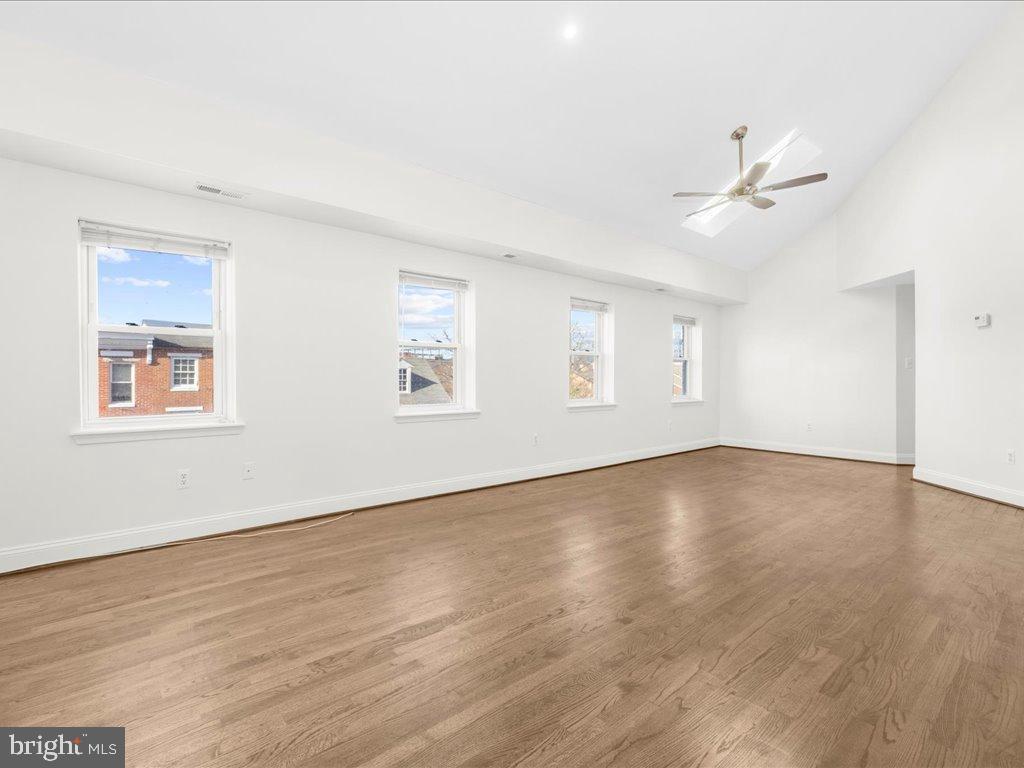 723 South Charles Street, Unit 306 Baltimore, MD 21230 - Photo 13 of 23 a view of empty room with wooden floor and fan