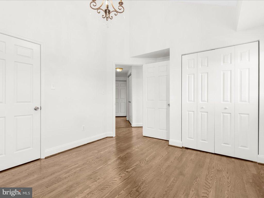 723 South Charles Street, Unit 306 Baltimore, MD 21230 - Photo 17 of 23 a view of an empty room with wooden floor