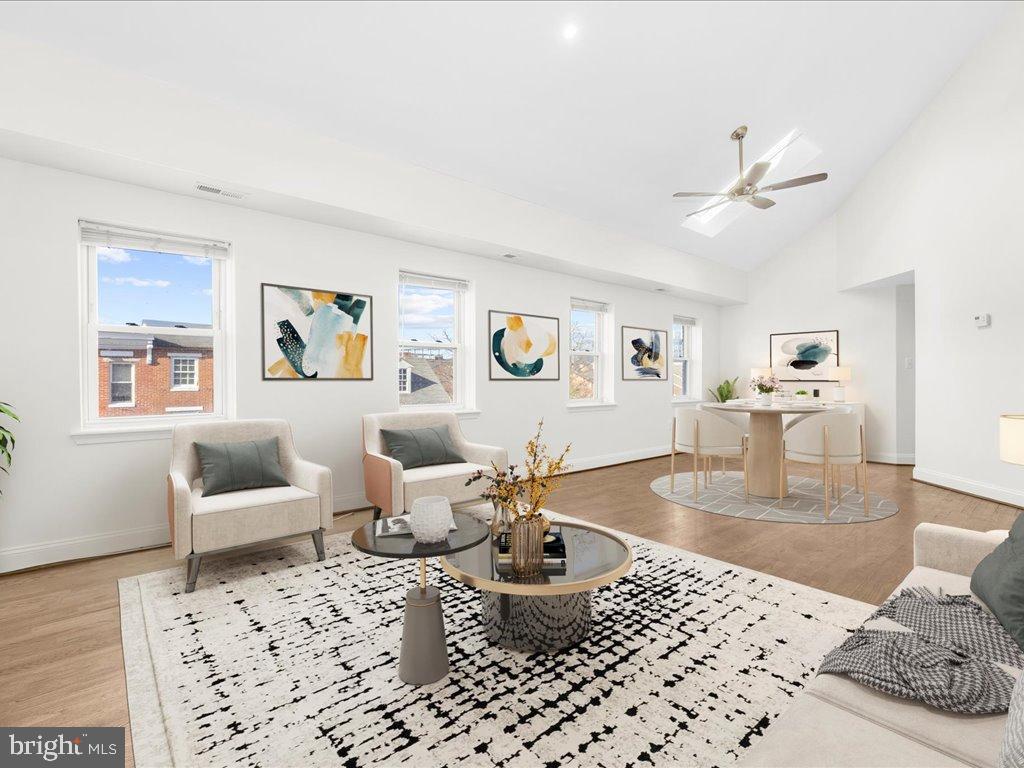 723 South Charles Street, Unit 306 Baltimore, MD 21230 - Photo 3 of 23 a living room with furniture and wooden floor