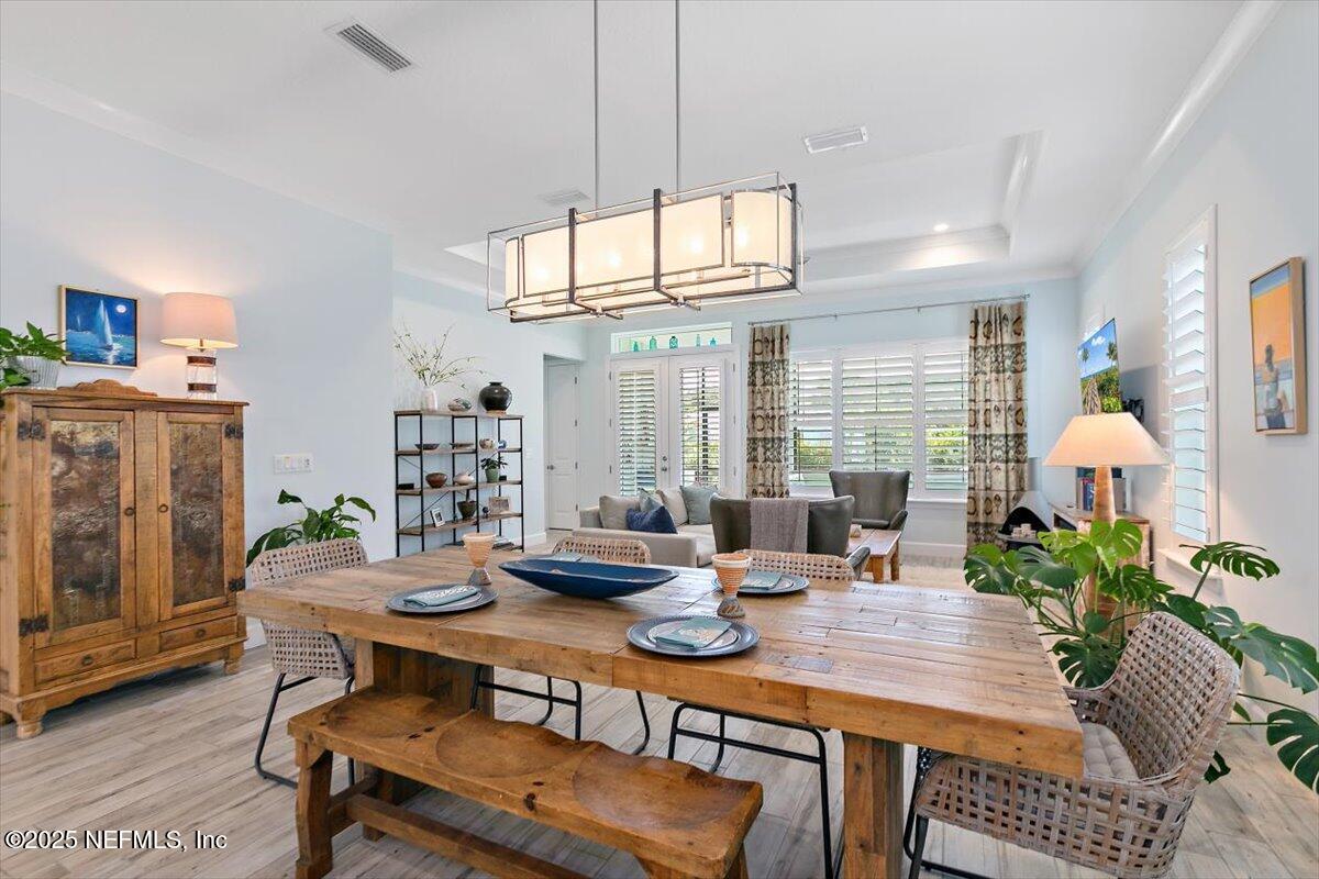 175 Oceanview Drive St. Augustine, FL 32080 - Photo 12 of 56 a view of a dining room with furniture window and wooden floor