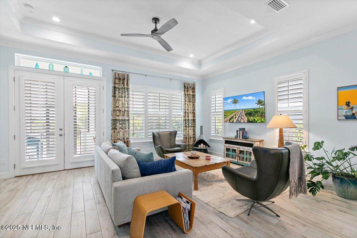 175 Oceanview Drive St. Augustine, FL 32080 - Photo 13 of 56 a living room with furniture floor to ceiling window and wooden floor