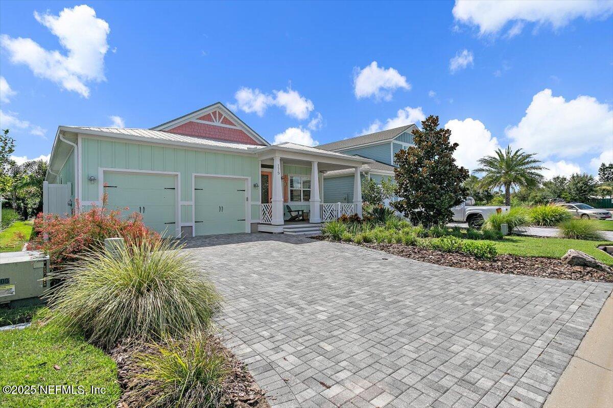 175 Oceanview Drive St. Augustine, FL 32080 - Photo 33 of 56 a view of a house with a yard and potted plants