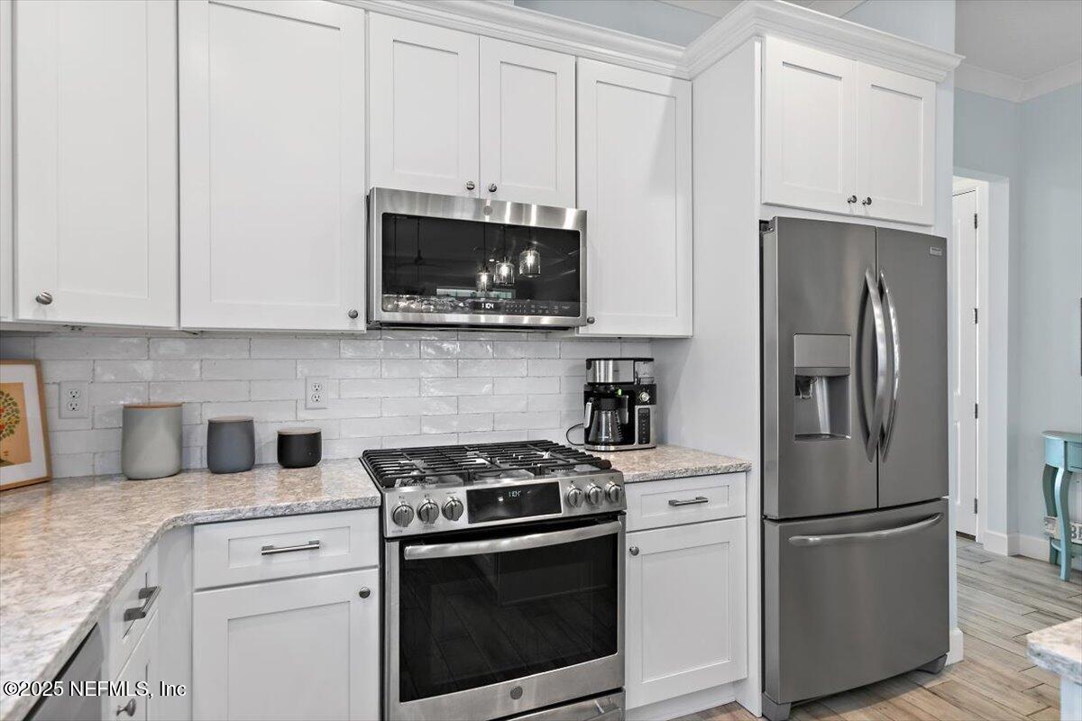 175 Oceanview Drive St. Augustine, FL 32080 - Photo 10 of 56 a kitchen with cabinets stainless steel appliances and a counter space