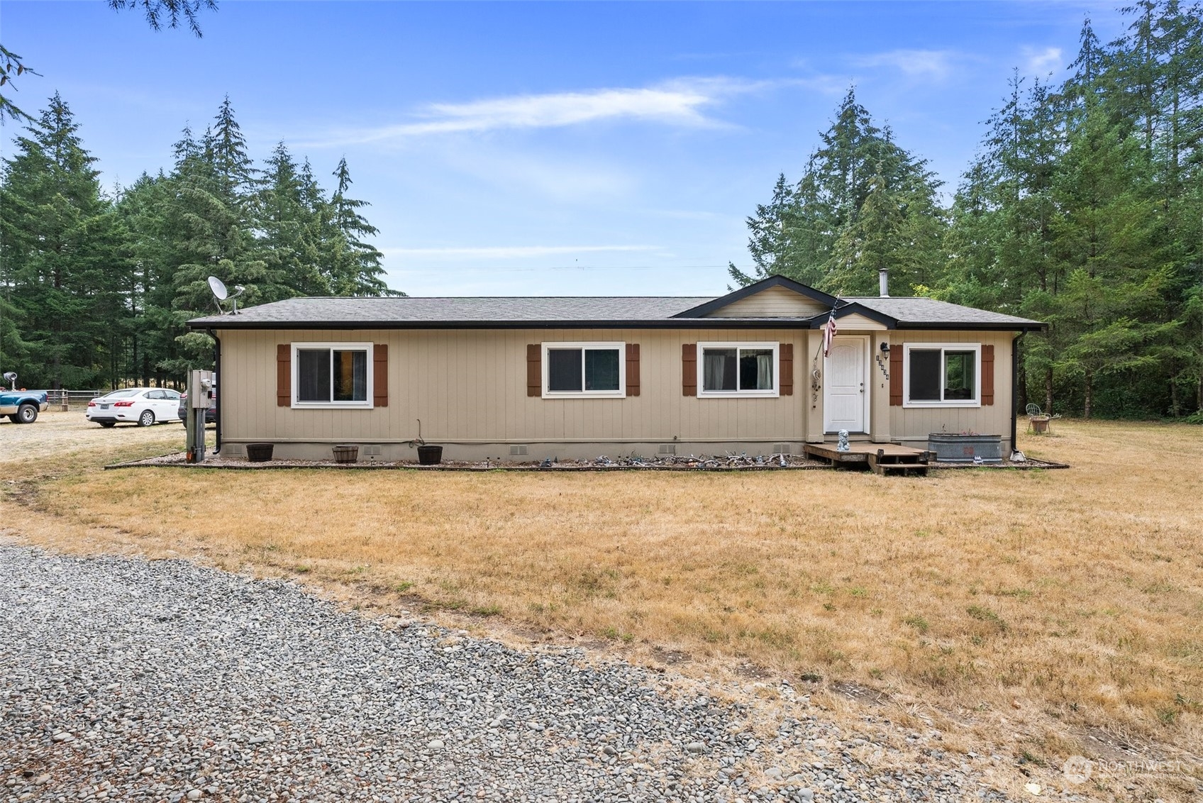 13434 Marcon Lane Southwest Rochester, WA 98579 - Photo 1 of 38 a front view of house with yard and trees around
