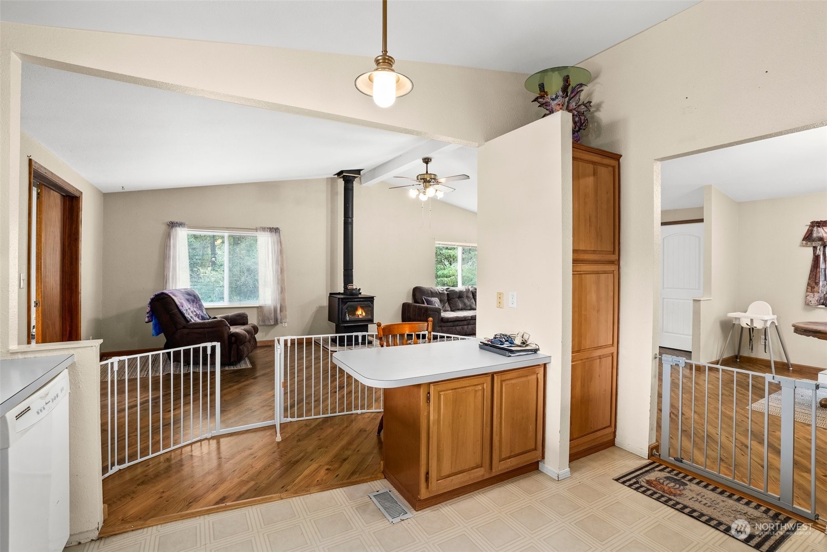 13434 Marcon Lane Southwest Rochester, WA 98579 - Photo 12 of 38 a dining hall with stainless steel appliances granite countertop a stove and a dining table with granite countertop wooden floor