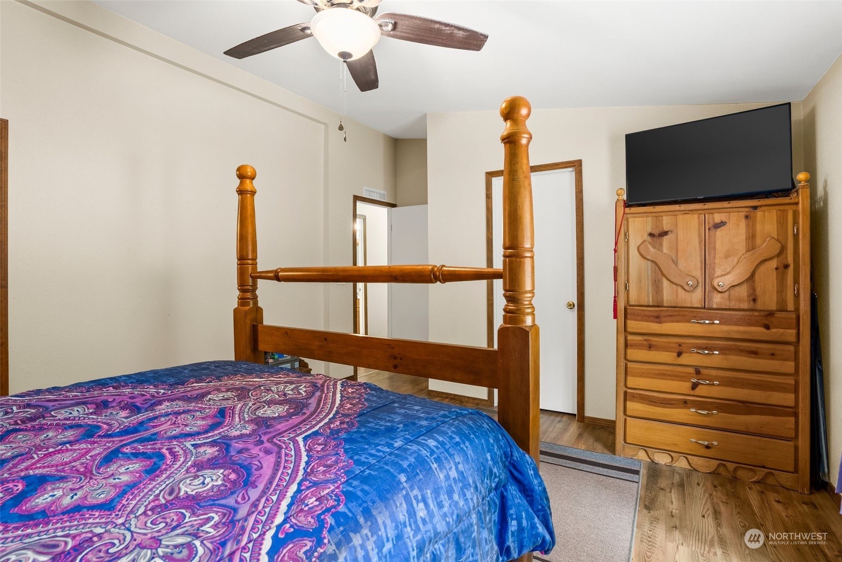 13434 Marcon Lane Southwest Rochester, WA 98579 - Photo 17 of 38 a bedroom with a bed and a flat screen tv