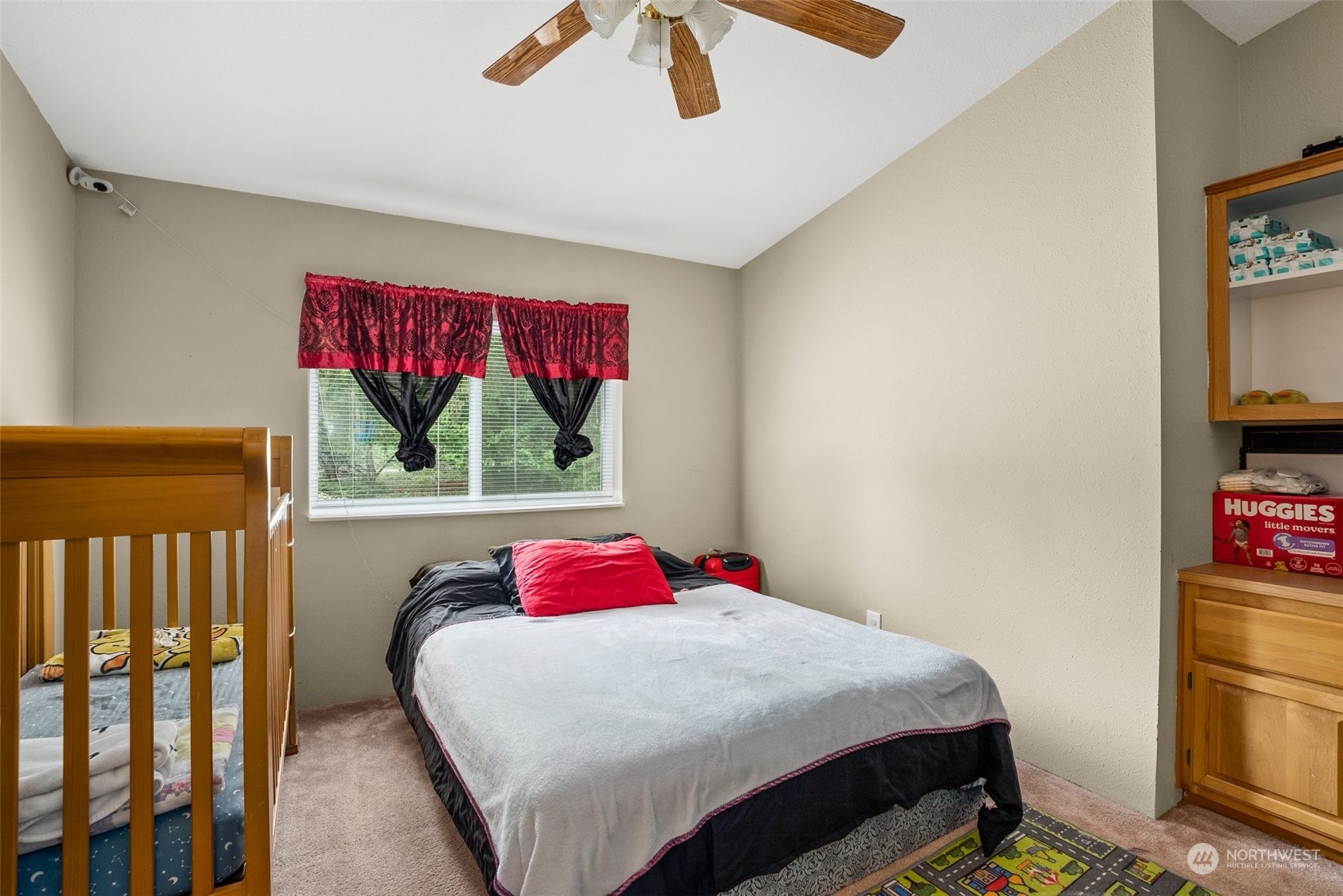 13434 Marcon Lane Southwest Rochester, WA 98579 - Photo 19 of 38 a bed sitting in a bedroom next to a window