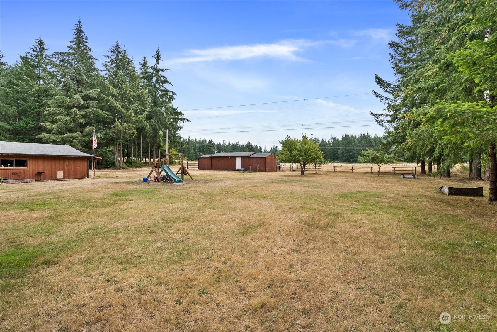 13434 Marcon Lane Southwest Rochester, WA 98579 - Photo 23 of 38 a view of outdoor space with garden and trees
