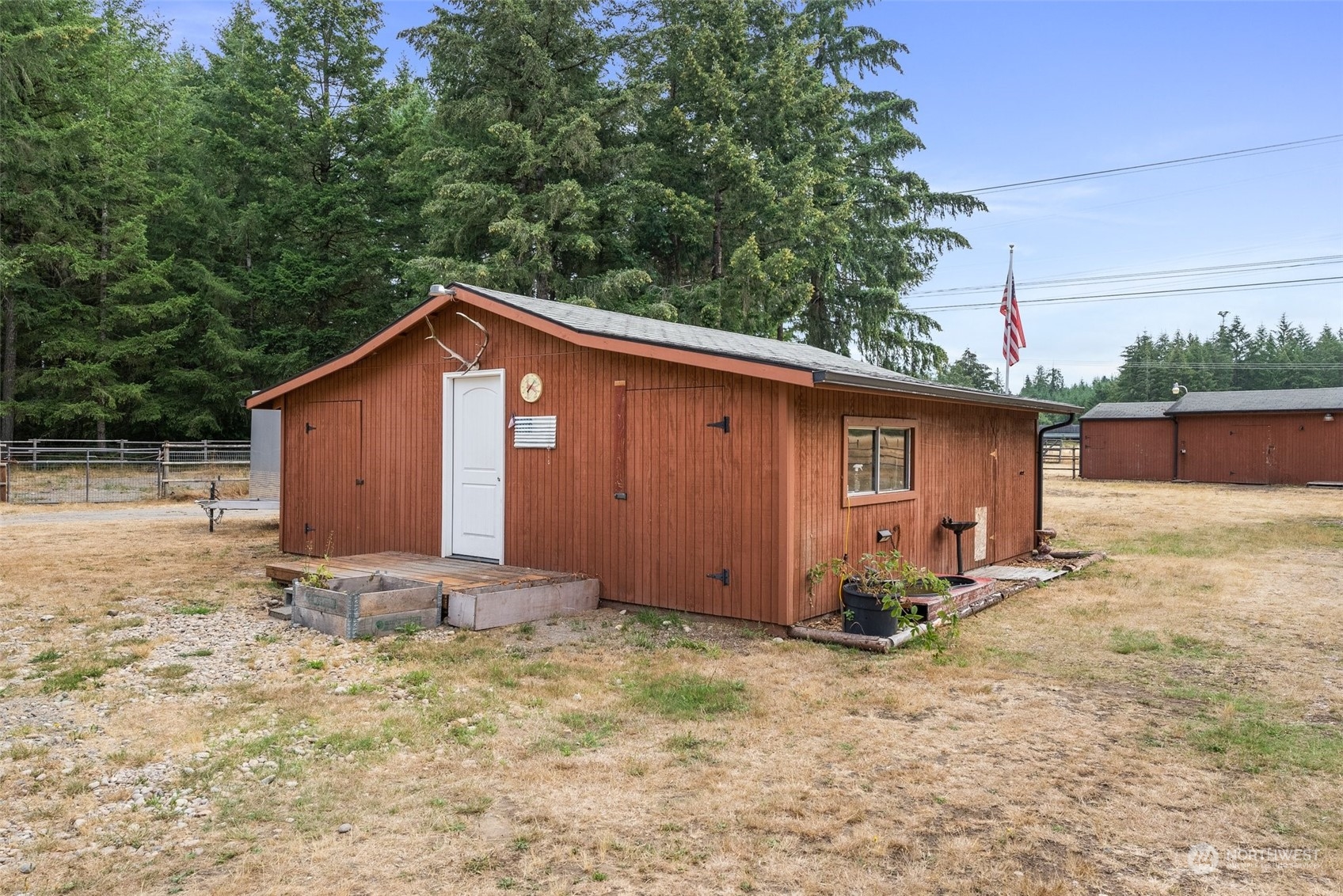 13434 Marcon Lane Southwest Rochester, WA 98579 - Photo 24 of 38 a backyard of a house with table and chairs