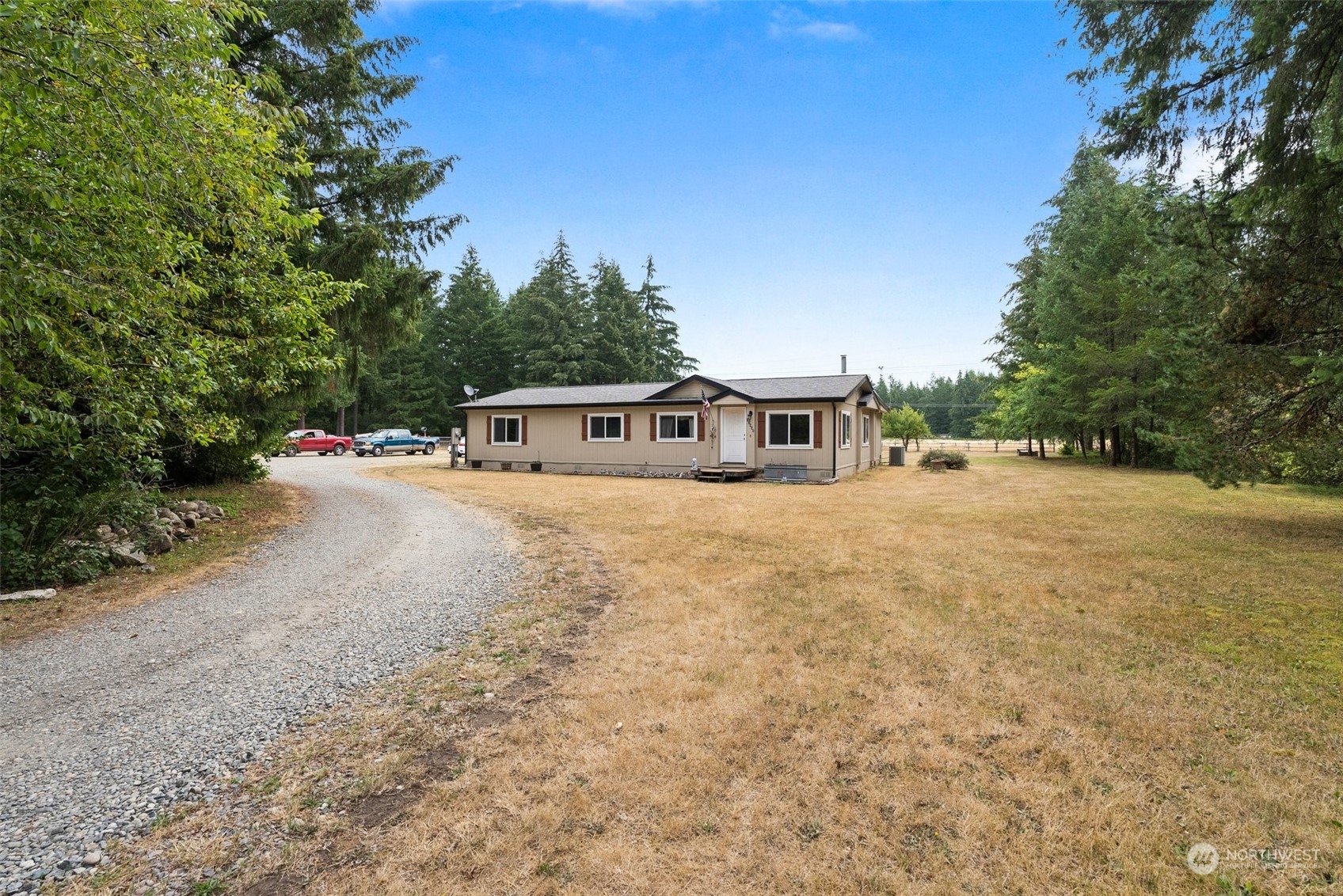 13434 Marcon Lane Southwest Rochester, WA 98579 - Photo 31 of 38 a house view with a yard