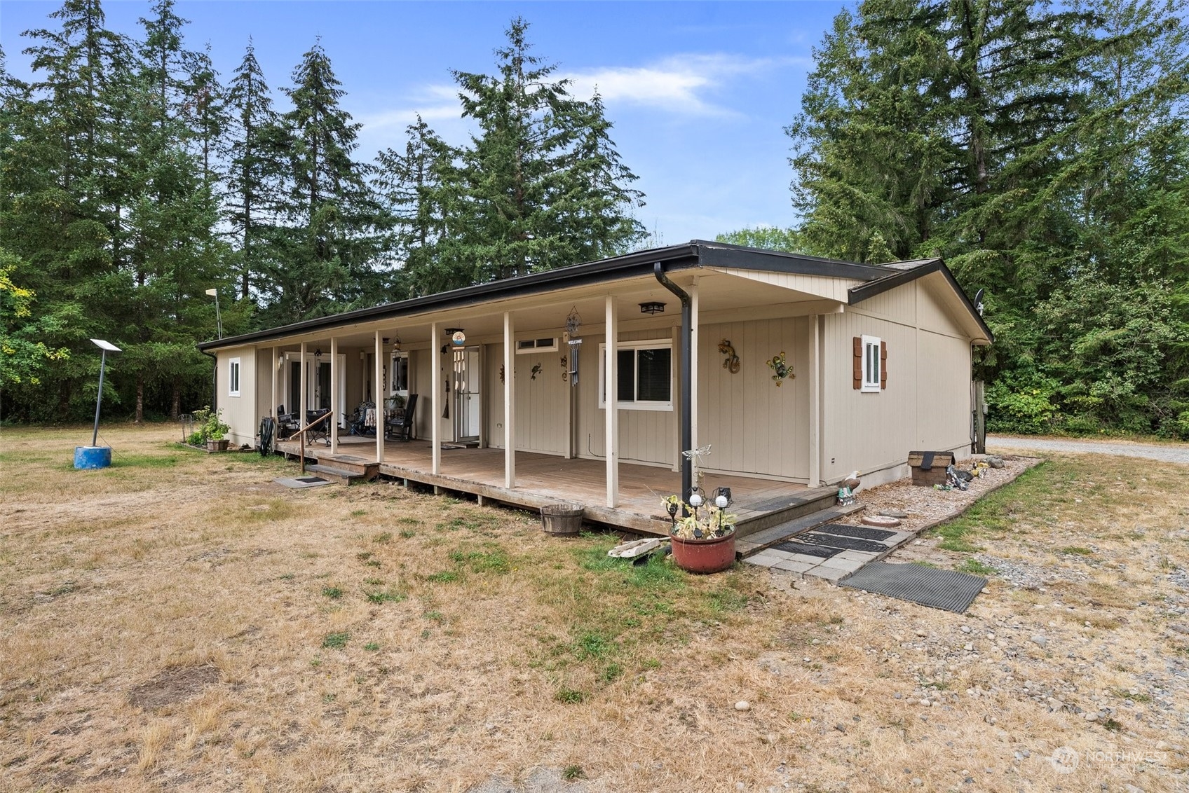 13434 Marcon Lane Southwest Rochester, WA 98579 - Photo 5 of 38 a view of a house with backyard and trees