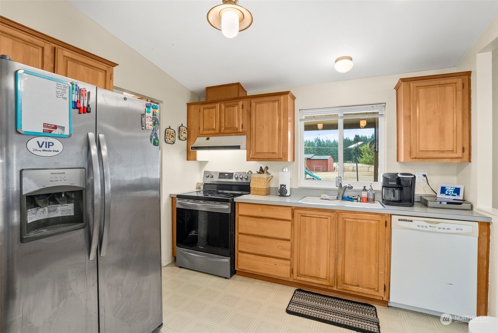 13434 Marcon Lane Southwest Rochester, WA 98579 - Photo 10 of 38 a kitchen with stainless steel appliances a refrigerator sink and cabinets