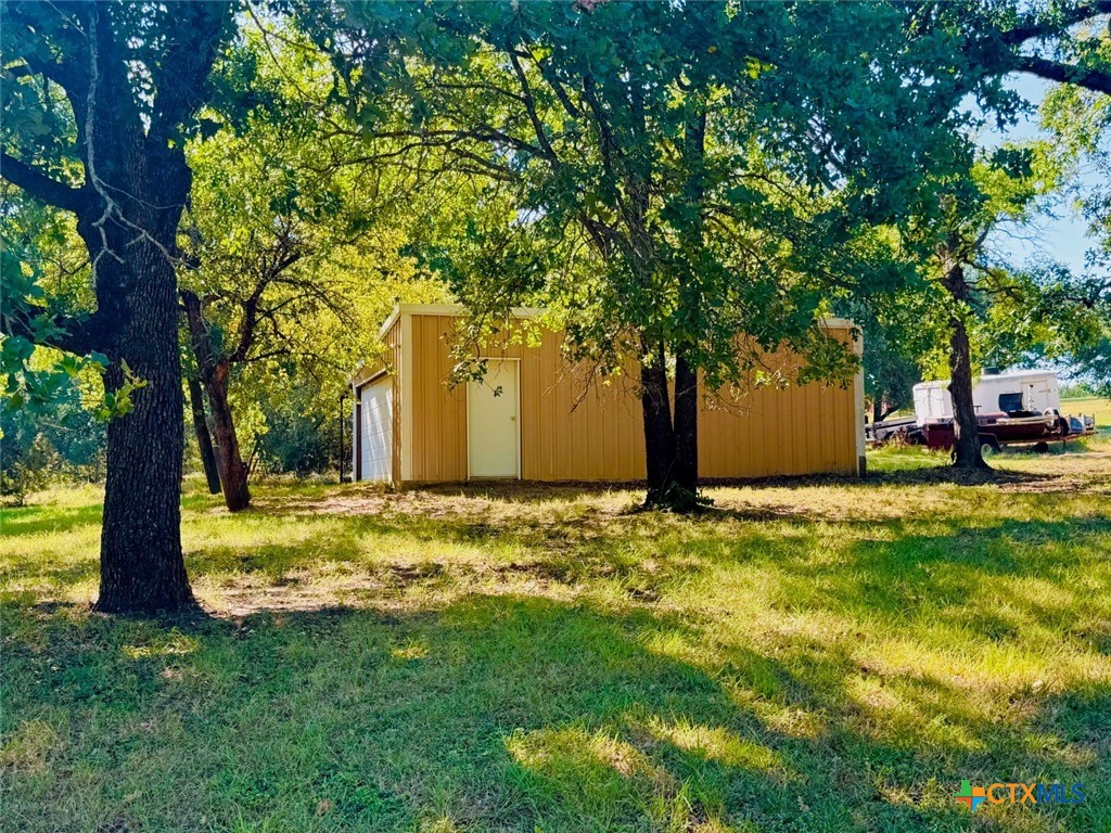 115 Oak Ridge Road Gatesville, TX 76528 - Photo 35 of 37 a view of a yard with a tree