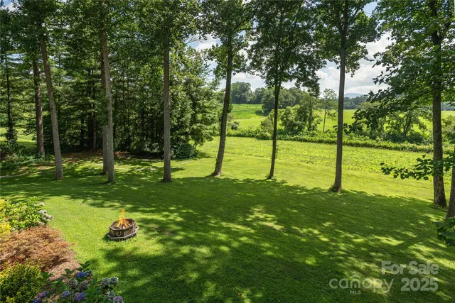 a view of an house with a backyard