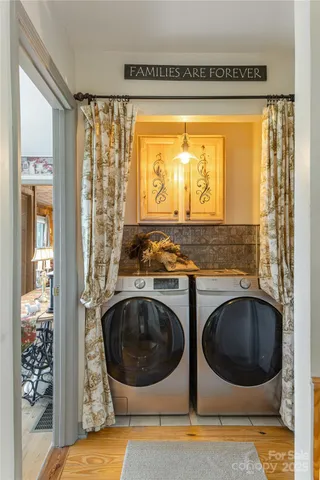 a view of a sink and washer and dryer