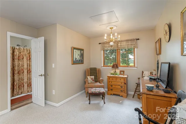a room with furniture and a chandelier