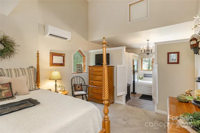 a bedroom with a bed and a couch