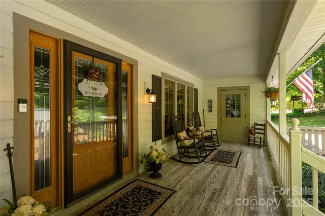 a balcony with furniture and wooden floor
