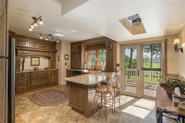 a very nice looking dining room with a large window and dining table