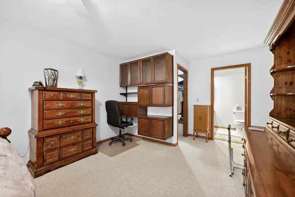 a view of workspace with furniture and closet
