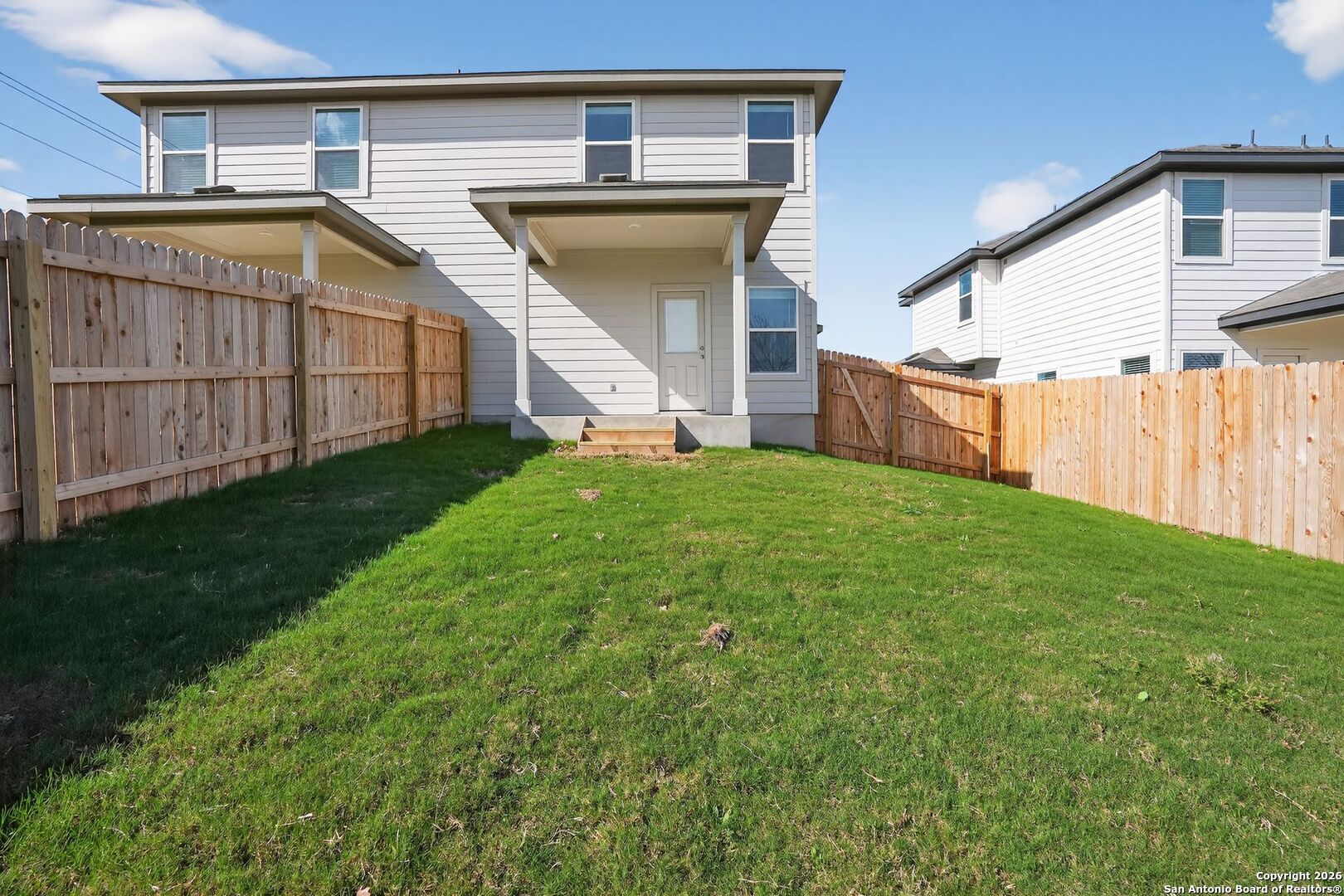 5402 Devils Gate, Unit 1 Converse, TX 78109 - Photo 18 of 20 a view of a house with a yard