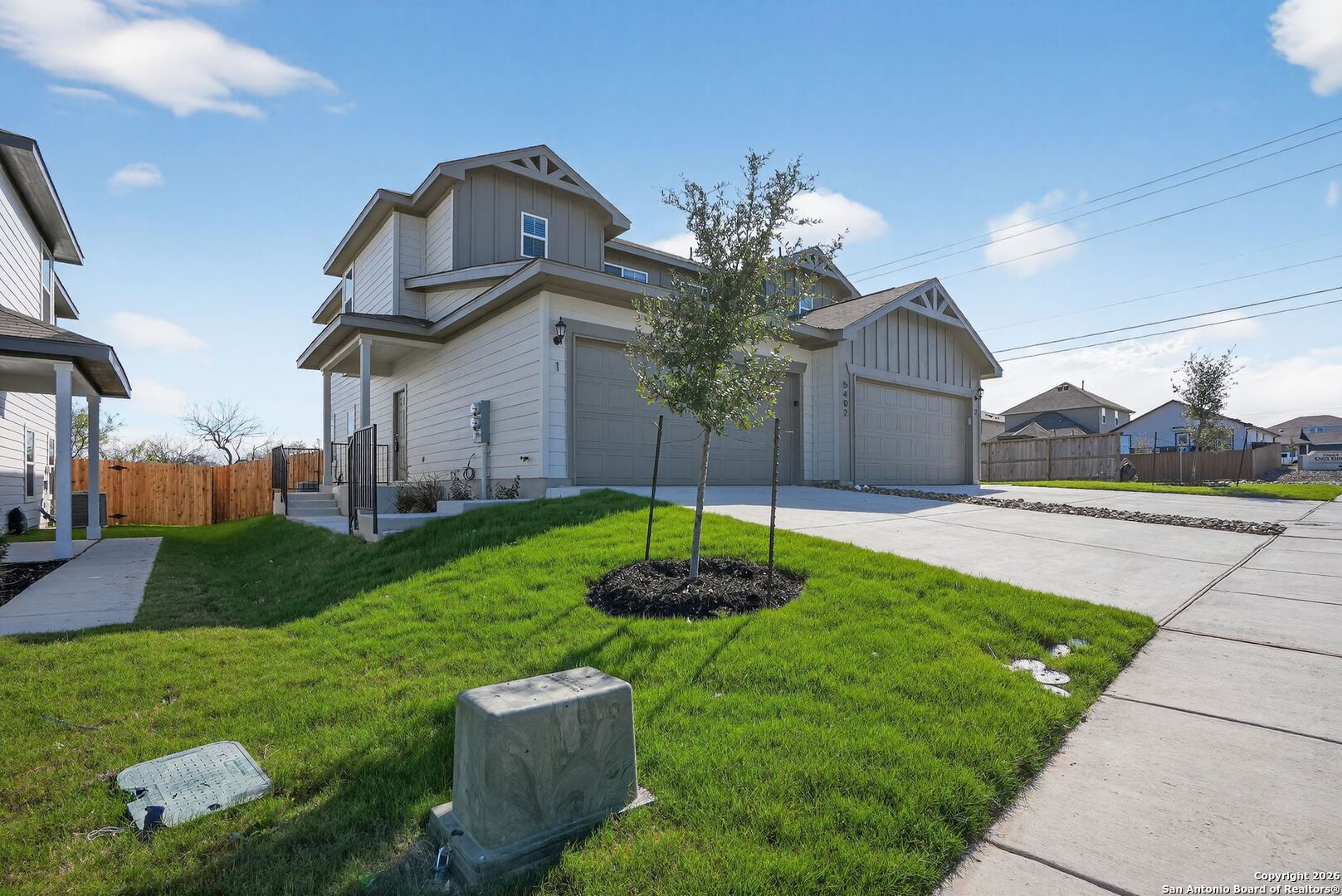 5402 Devils Gate, Unit 1 Converse, TX 78109 - Photo 3 of 20 a front view of a house with garden