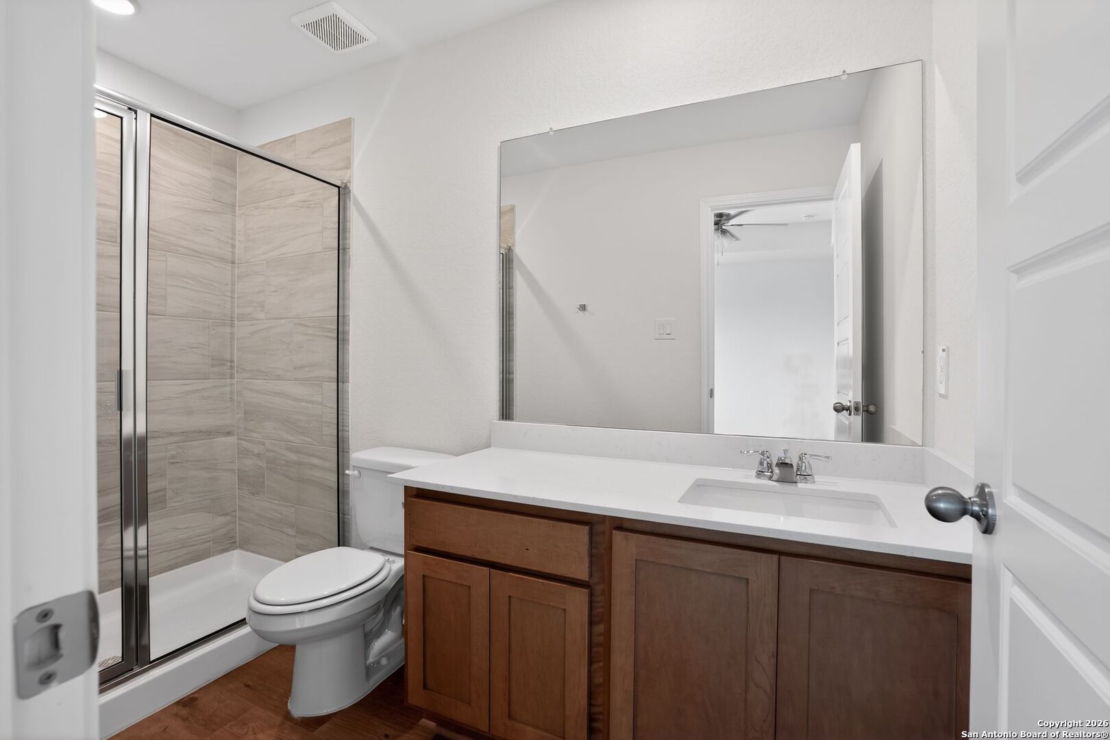 5402 Devils Gate, Unit 1 Converse, TX 78109 - Photo 8 of 20 a bathroom with a sink and a mirror