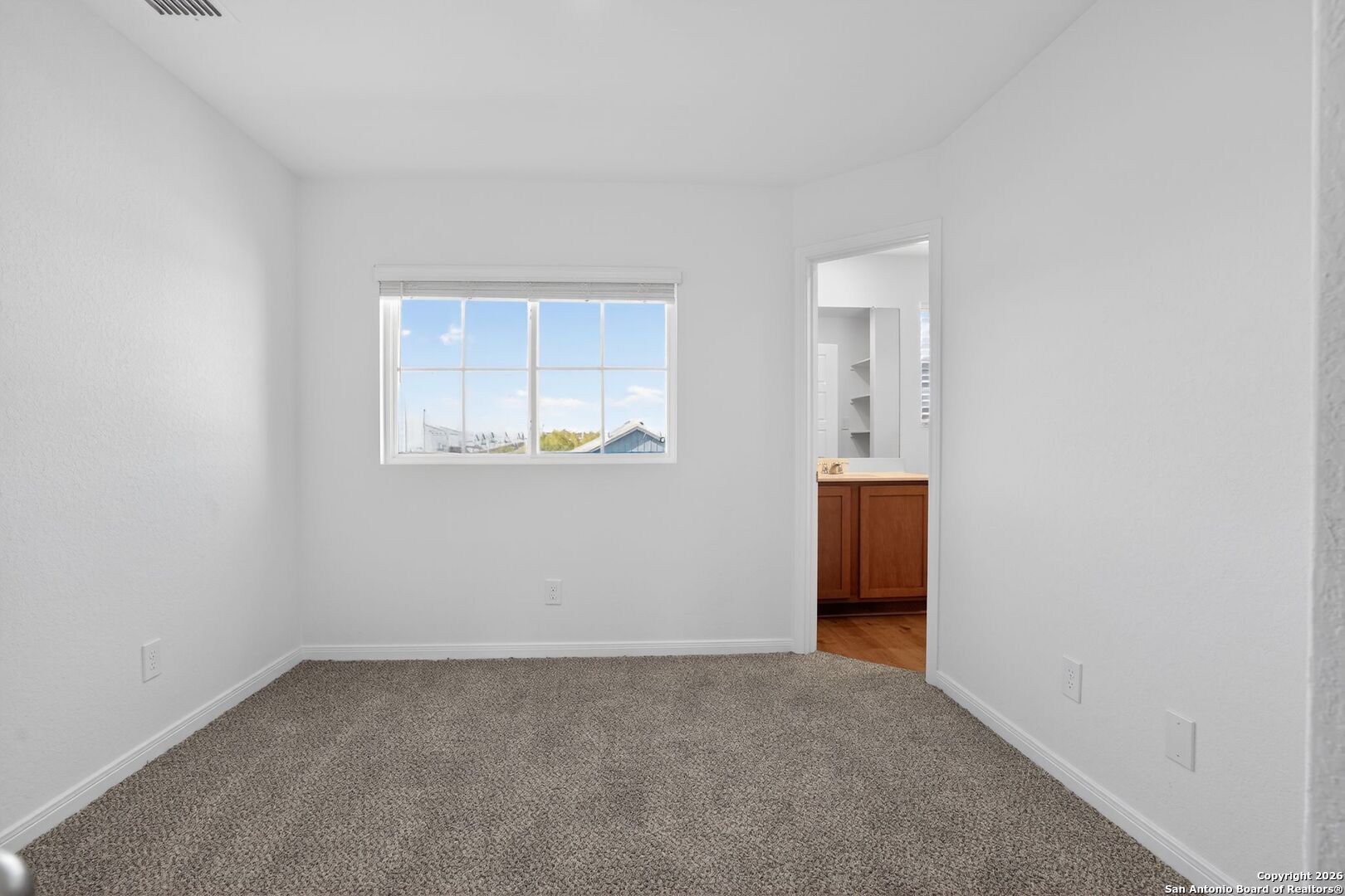 5402 Devils Gate, Unit 1 Converse, TX 78109 - Photo 10 of 20 an empty room with windows and closet