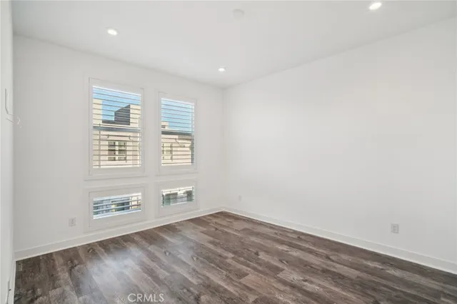 a spacious bathroom with a granite countertop sink and a mirror