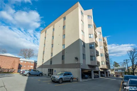 a view of car parked in front of house